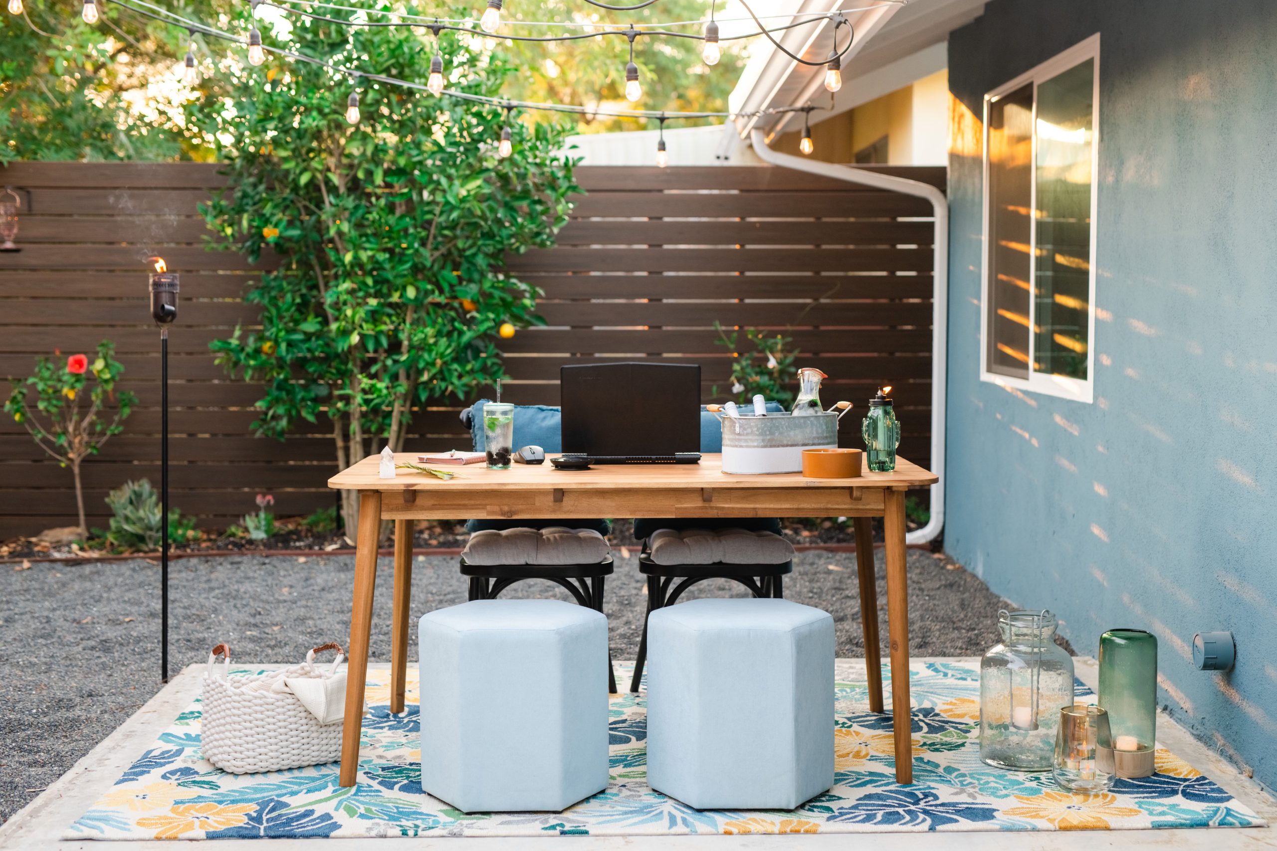Cozy backyard retreat with simple outdoor seating and string lights