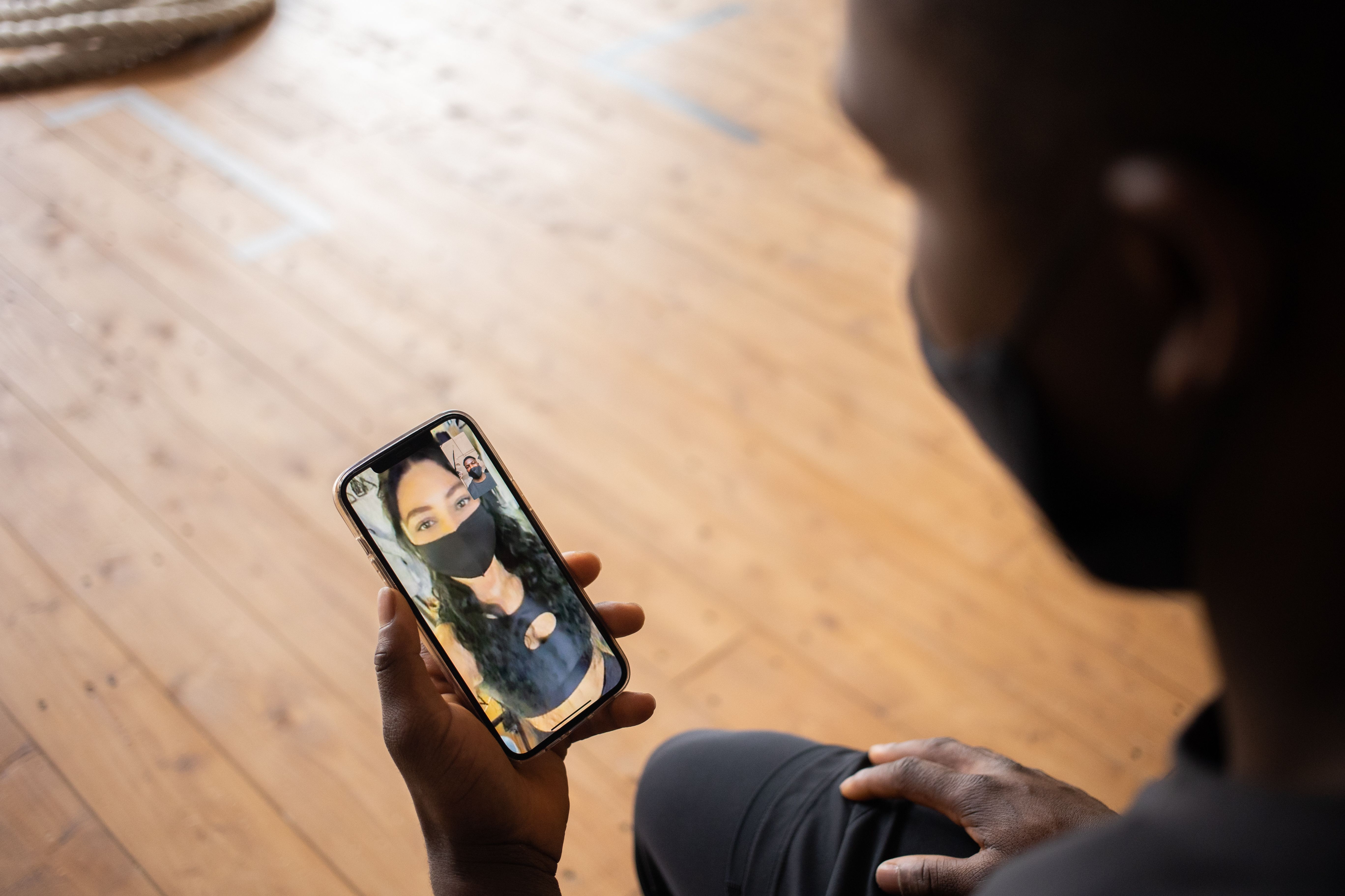 Two people talking over a smartphone video call, showing how digital services can create a sense of personal connection.